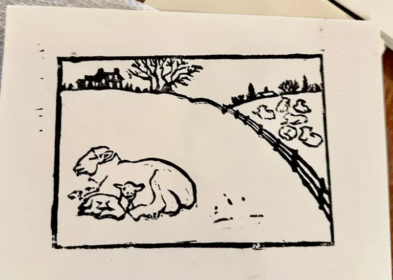 A linocut print of two sheep resting on a hillside